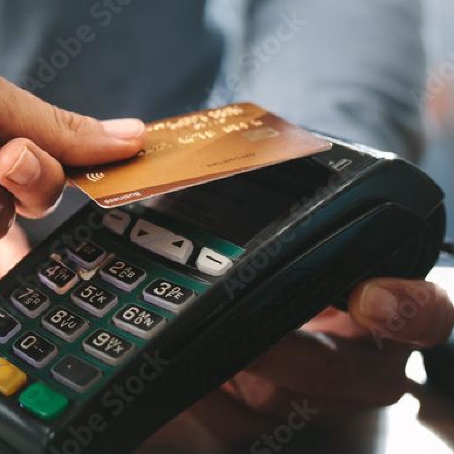 Pharmacist accepting credit card by contactless payment